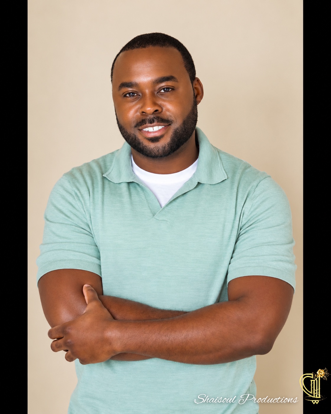 Studio headshot in a mint polo shirt, with AI-assisted photo finishing